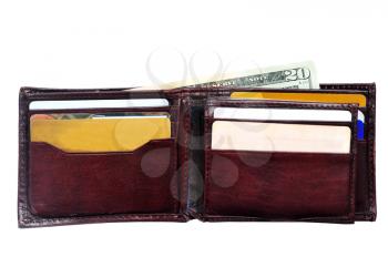 An open leather wallet with a twenty dollars  bill isolated on white