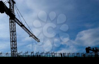 building a house. building cranes on a blue sky background