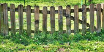 old wooden fence on green lawn