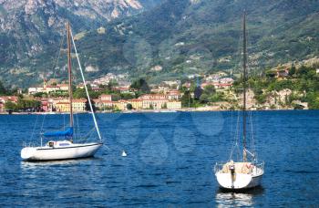 boats in the lake water in Lecco. Parked yachts and boats on lake Como