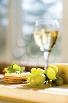 cheese and crackers on a cutting board