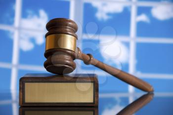 Wooden justice gavel and block with brass