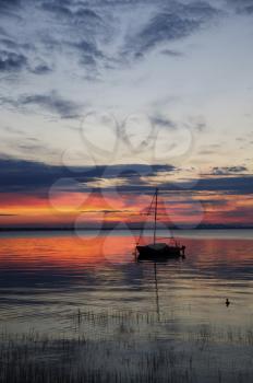 watching a sunset on the calm water