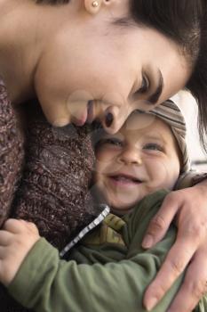 Mother and baby together in a very intimate moment.