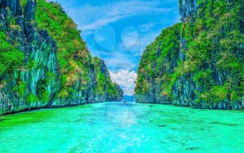 Scenery with tropical rock islands and crystal clear water