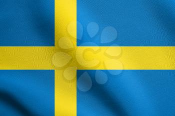Flag of Sweden waving in the wind with detailed fabric texture. Swedish national flag.