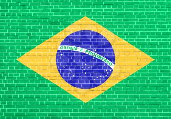 Flag of Brazil on brick wall texture background. Brazilian national flag.