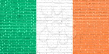 Flag of Ireland on brick wall texture background. Irish national flag.