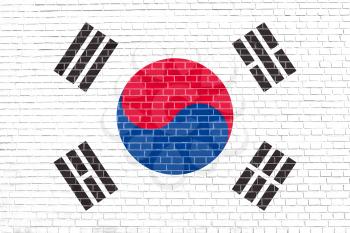 Flag of South Korea on brick wall texture background. South Korean national flag.