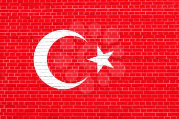 Flag of Turkey on brick wall texture background. Turkish national flag.