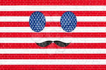 Funny face made of USA flag simbols with mustaches  on brick wall texture background. Face painted in style of the American flag. Patriotic design in the United States of America flag colors.
