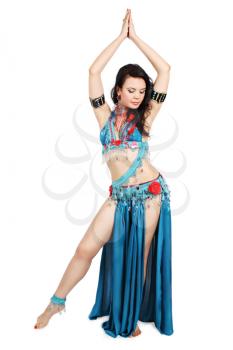 Beautiful woman dancing belly dance isolated on a white background