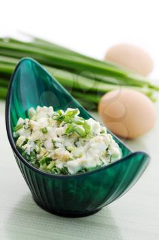 Spring salad with onions and boiled eggs