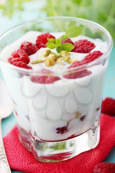 Delicious dessert with fresh raspberries and pistachios