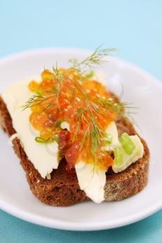 sandwich with butter, caviar, dill and onion