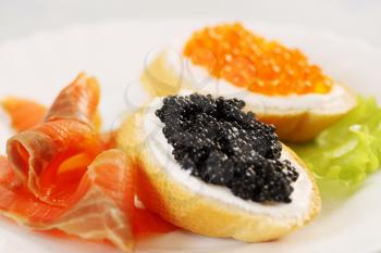 sandwich with red, black caviar and salmon