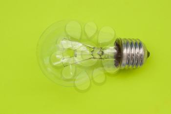 Light bulb on a green background