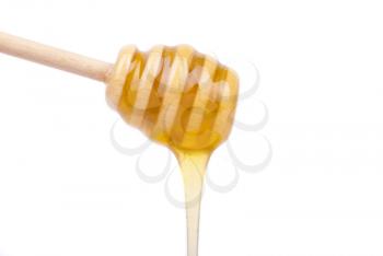 Honey dripping from a spoon for honey.