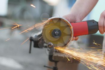 Worker cuts metal.