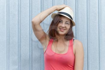 Portrait of beautiful girl in hat outdoors.