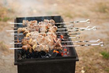 Meat skewers fried on the grill.