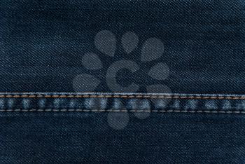Texture of denim and seam on jeans.