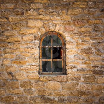 Old wall from the Jerusalem stone and window with lattice window
