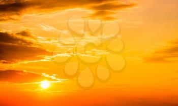 Sunset, sunrise with clouds. Yellow warm sky background