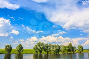 Summer Landscape With River And Blue Sky.