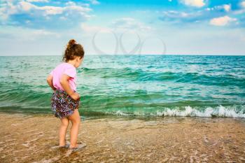 Happy Active Child Girl Having Fun On Beautiful Beach. Child Running On Water At Ocean Beach.