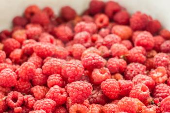Sweet Fresh Raspberries Close Up Background.