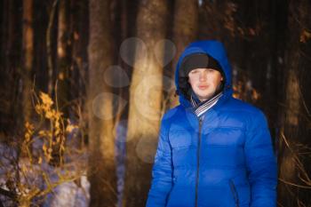 Portrait Of Young Cheerful Man Outdoor In Winter Forest