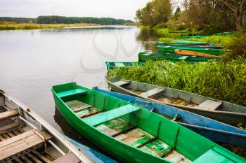 Autumn River And Colorful Rowing Boats On Coastline. Russian Landscape, Nature