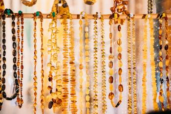 Variety Of Beads Made Of Amber. Jewellery Made Of Amber. Traditional Souvenirs At European Market. Souvenir From Baltic Countries, Europe.