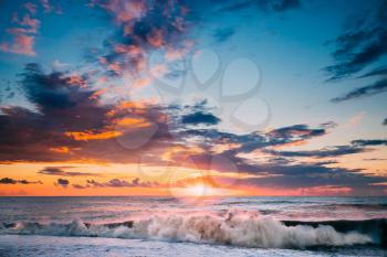 Sun Is Shining Over Horizon At Sunset Or Sunrise. Evening Sea Or Morning Ocean. Sea Ocean Waves In Colorful Sunset Sunrise Sky Lights. Natural Sky Warm Colors.