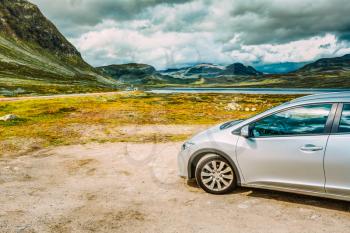 Car Stands On Roadside Against Background Of The Norwegian Mountain Landscape
