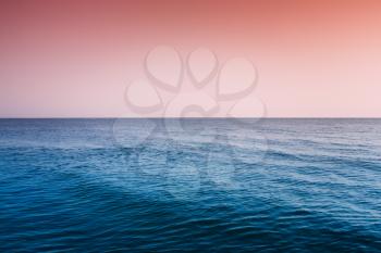 Calm Sea Ocean And Red Clear Sunset Sunrise Sky  Background