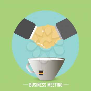 Businessmen have agreed on business meeting and there is a handshake behind a cup of tea, coffee. Business concept