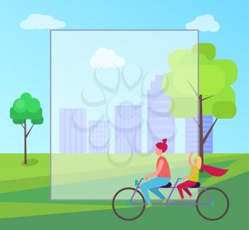 Redhead mother and her young blonde daughter riding purple tandem bicycle on background of skyscrapers in city park with frame for text.