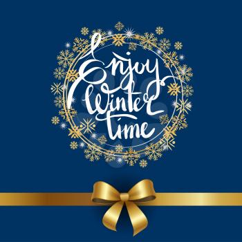 Enjoy winter time inscription written in frame made of golden and silver snowflakes and snowballs on blue with ribbon and bow in bottom of vector