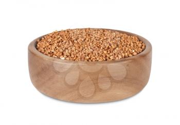 Buckwheat in a wooden bowl, isolated on white