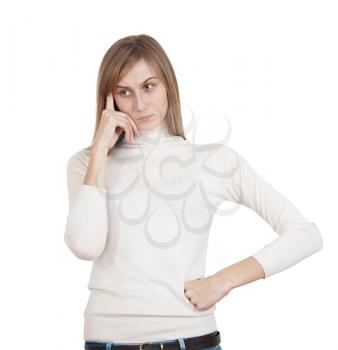 sad young girl in white sweater hand to face thought