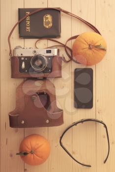 Travel set of things sunglasses, passport, camera phone and tropical fruits oranges