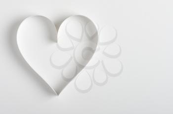 Heart made of paper on white background