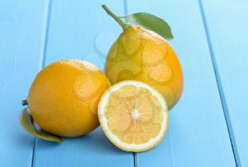 lemons on a wooden table painted in blue