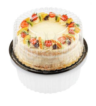 round cake with fruit and berries in a plastic container isolated on a white background with clipping path