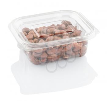 peanuts groundnuts in a transparent plastic container isolated on a white background with clipping path