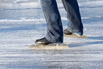 A ice skater is skating on the famous dutch Bonkevaart Friese Elfstedentocht
