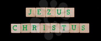 Green letters on old wooden blocks (Jezus Christus)