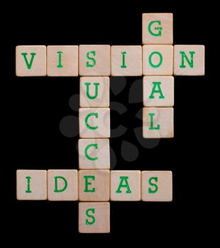 Green letters on old wooden blocks (vision, goal, succes, ideas)